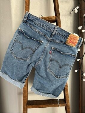 Levi's blue long cut off shorts, size 32